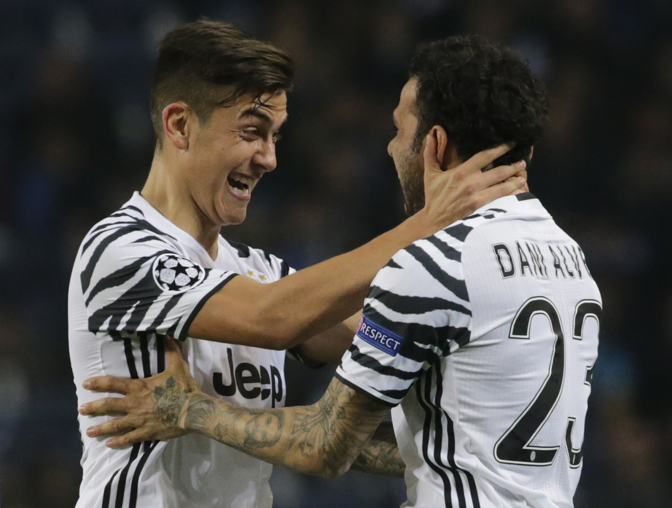 Juventus' Dani Alves celebrates scoring their second goal with Paulo Dybala - 17-CCT51731