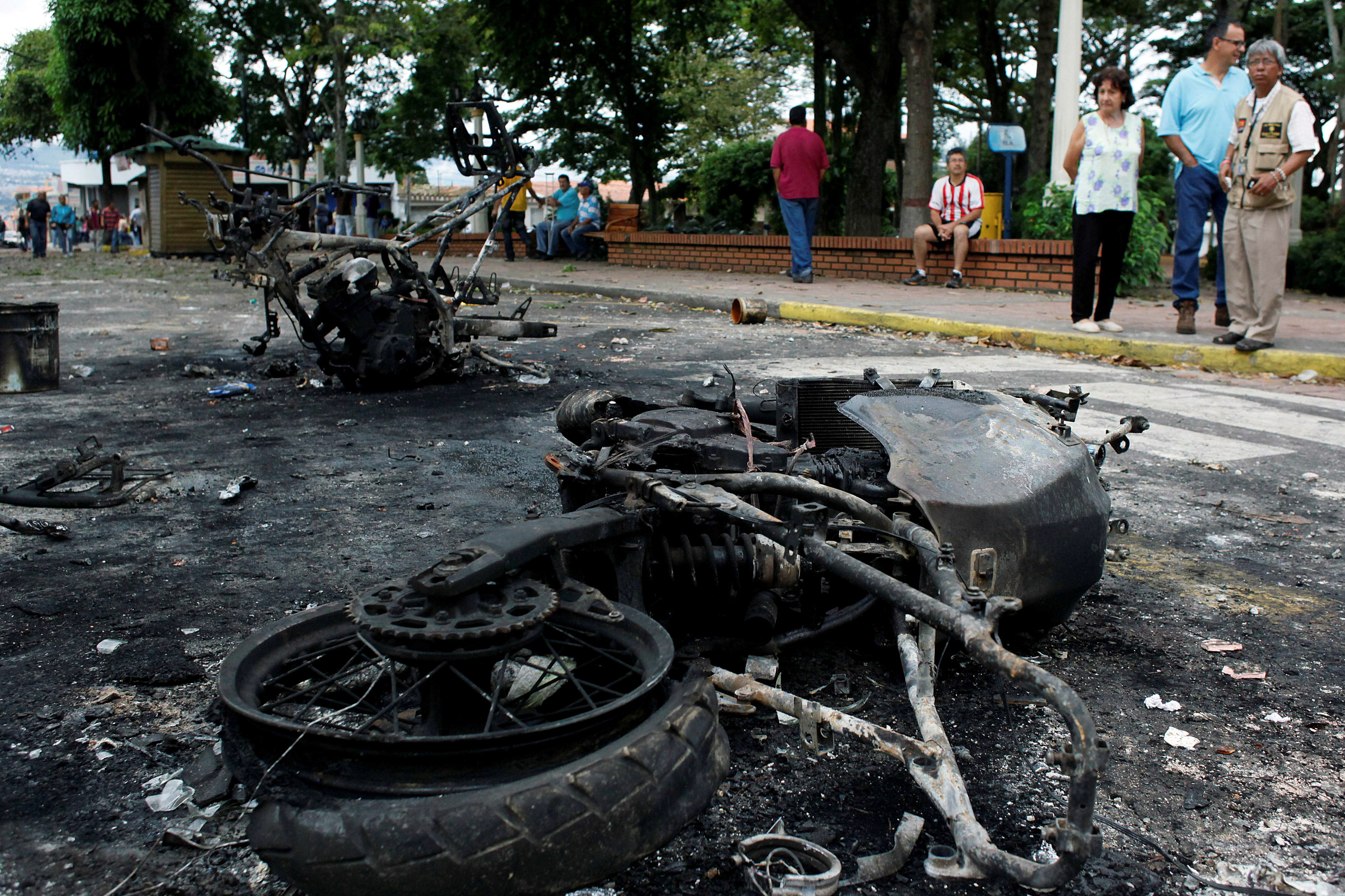 Burnt police motorcycles are seen during a protest against Venezuela's President Nicolas Maduro's government in Palmira