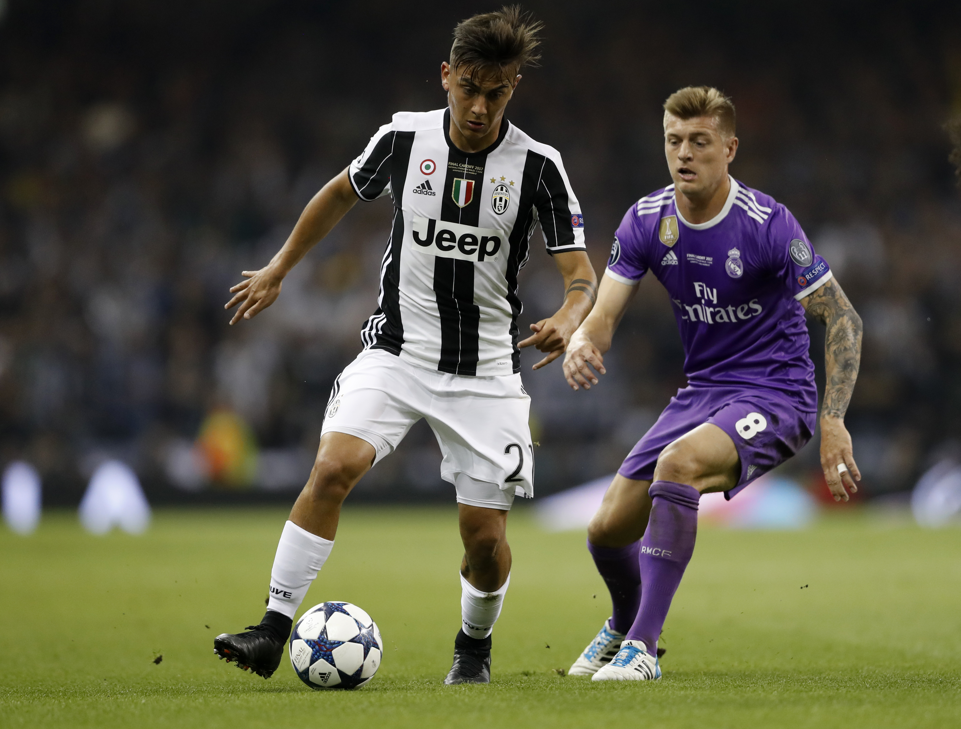Juventus' Paulo Dybala in action with Real Madrid's Toni Kroos - 17-CCT51731