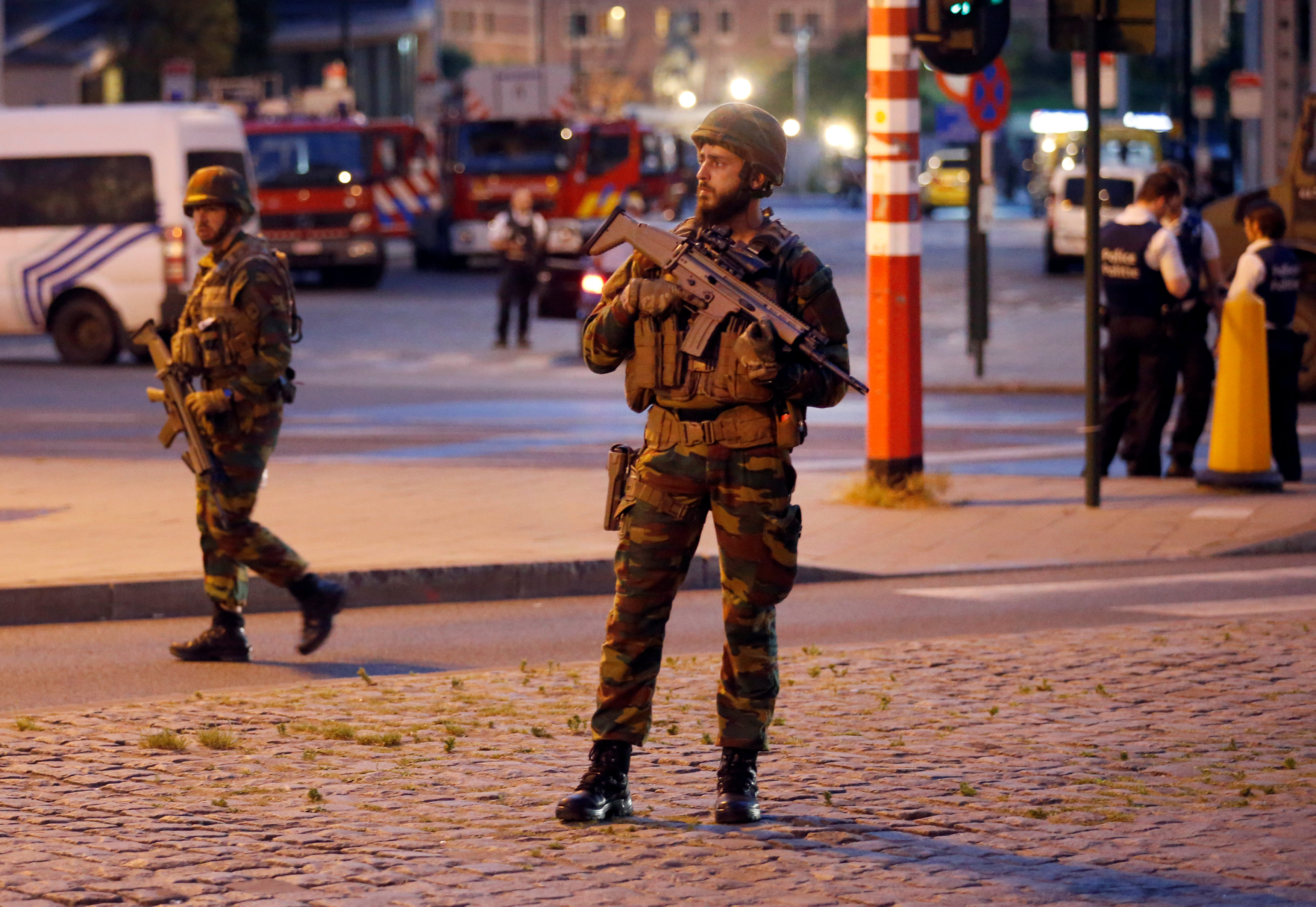 Belgian troops take up position following an explosion at the Central Station in Brussels.