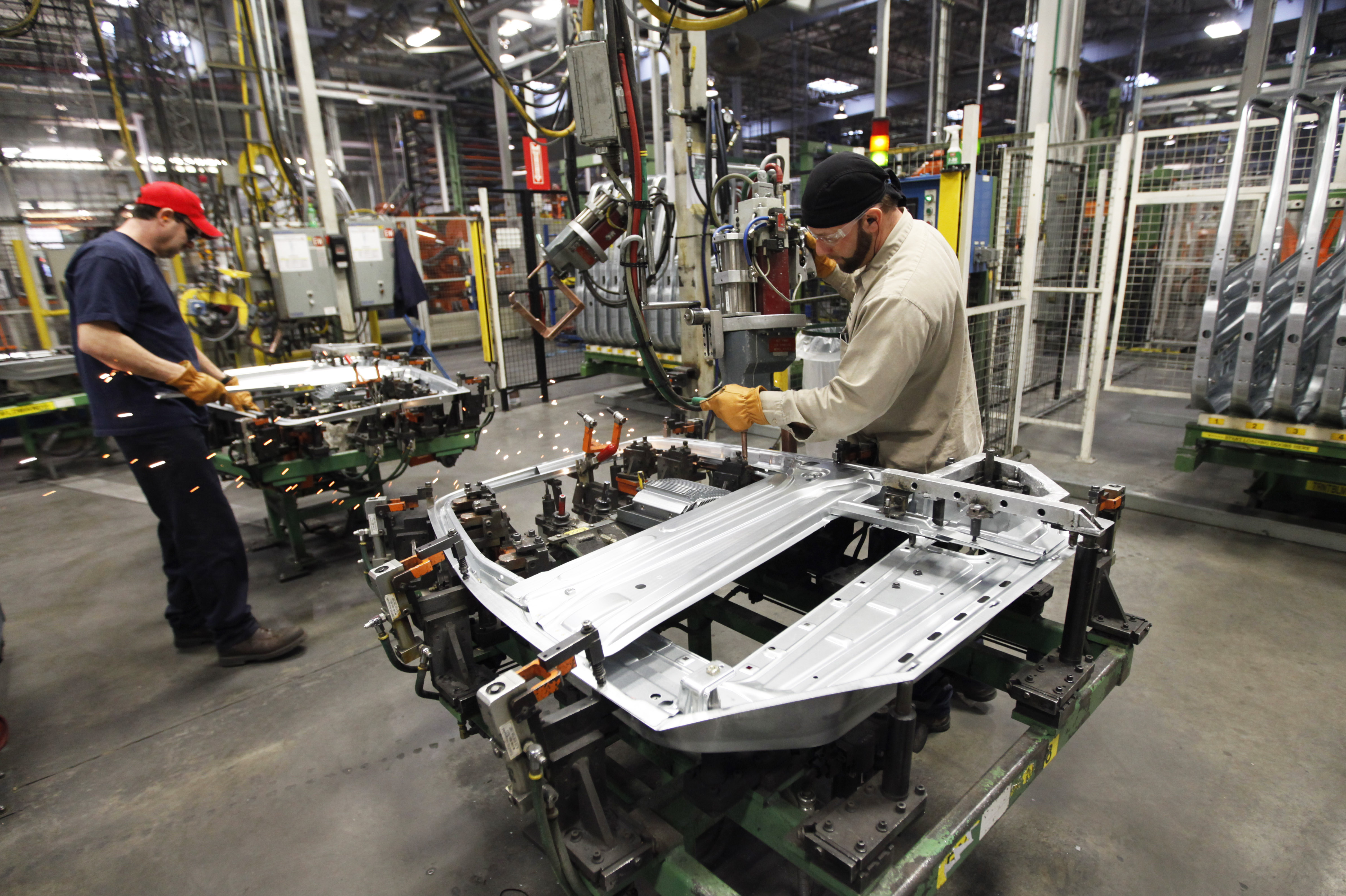 workers work on the Volvo truck assembly line at the Volvo plant in Dublin, Va., Wednesday, Jan. 26, 2011.. (AP Photo/Steve Helber) - JAN. 26, 2011 PHOTO