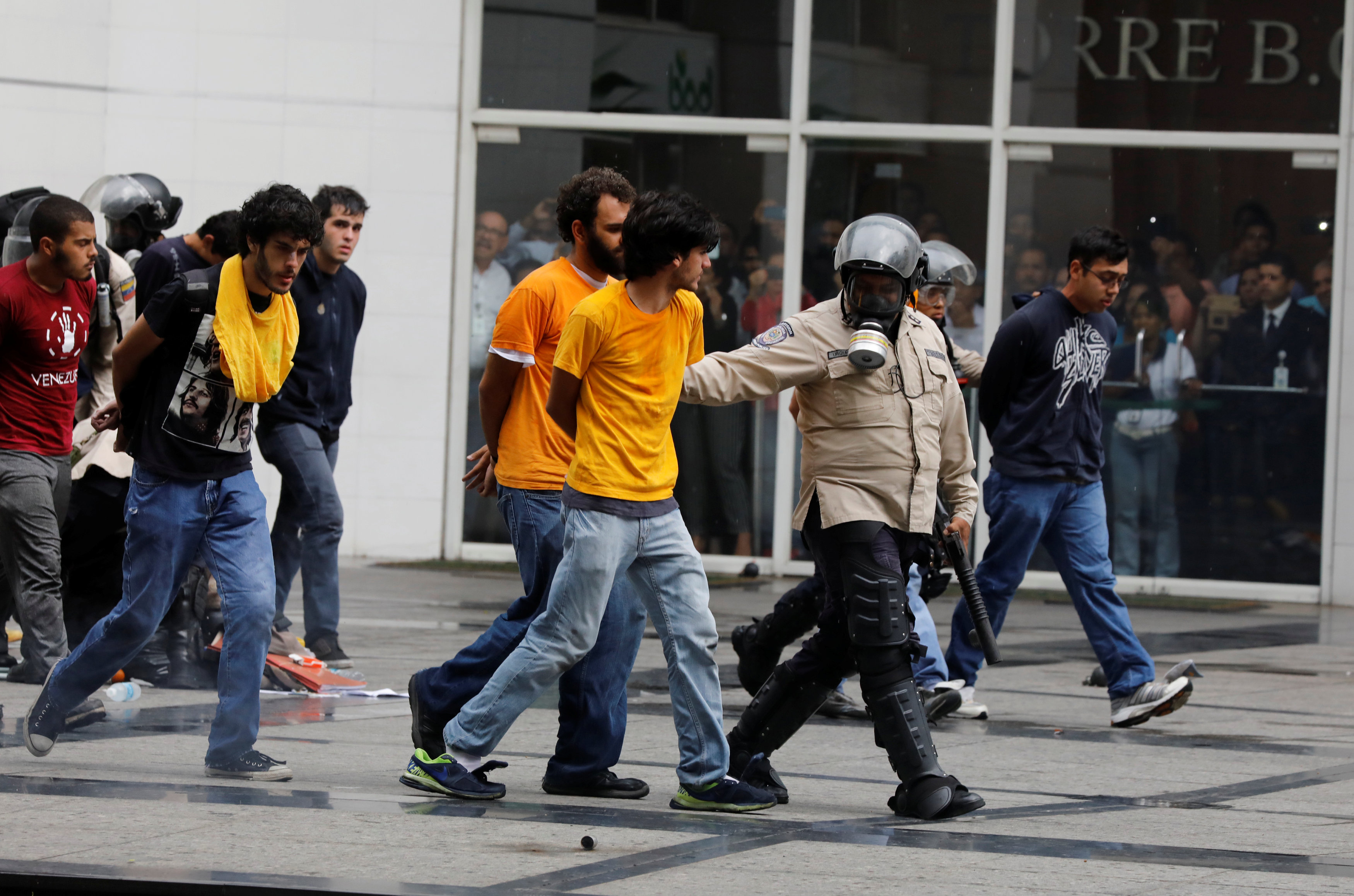 Police detain protesters during a rally against Venezuela's President Nicolas Maduro's government in Caracas