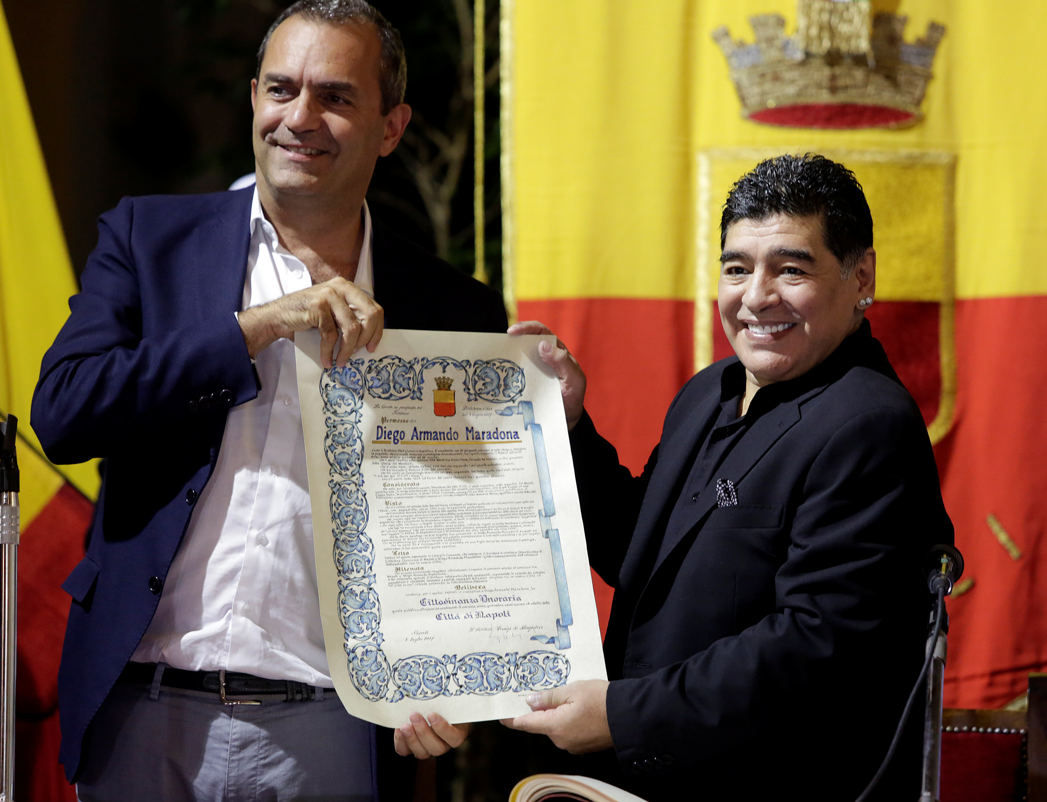 Naples mayor Luigi De Magistris pose with former football player Diego Armando Maradona as he receive honorary citizenship of the city in Naples - NARCH/NARCH30