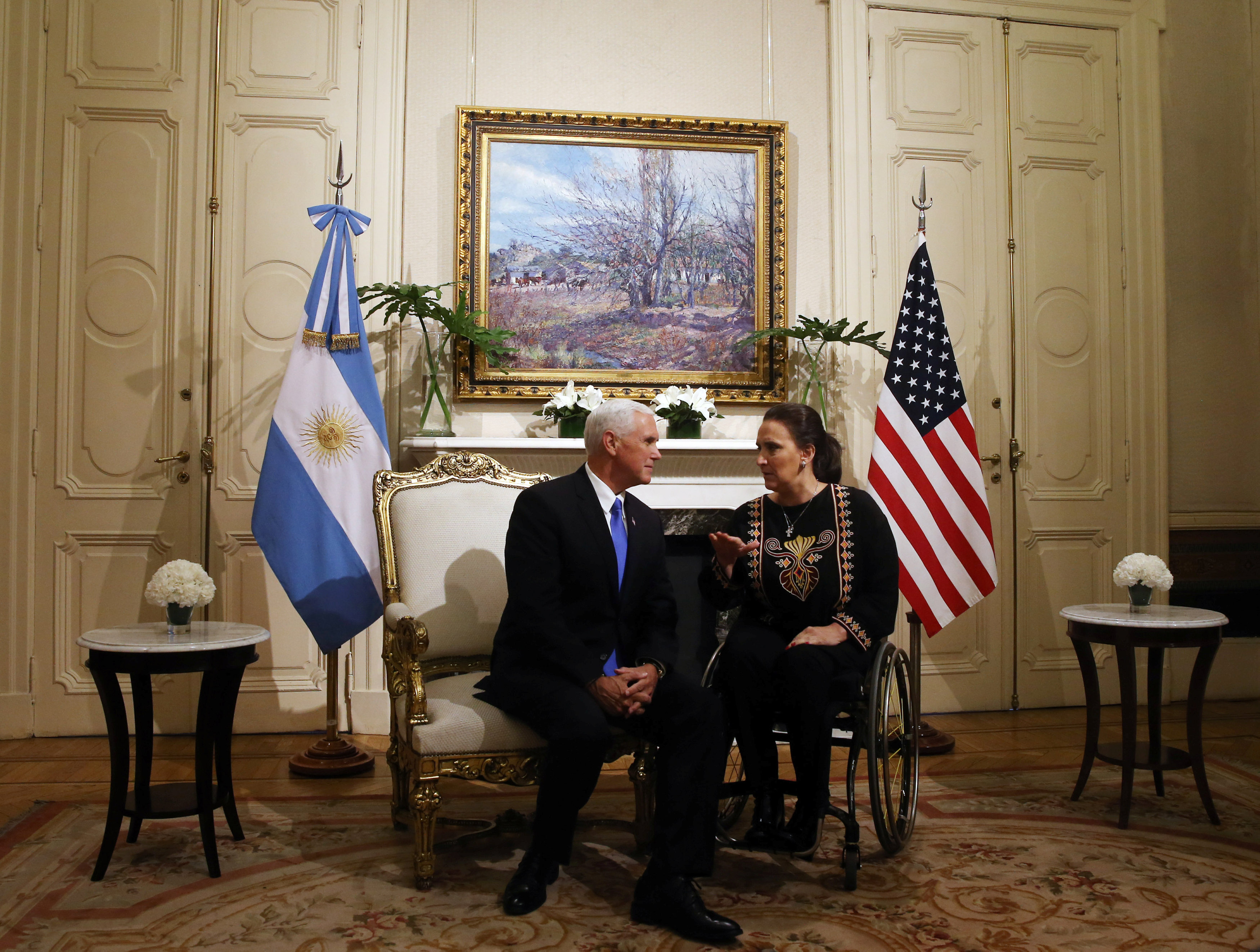 Argentina's Vice President Michetti talks to U.S. Vice President Pence at Casa Rosada Presidential Palace in Buenos Aires