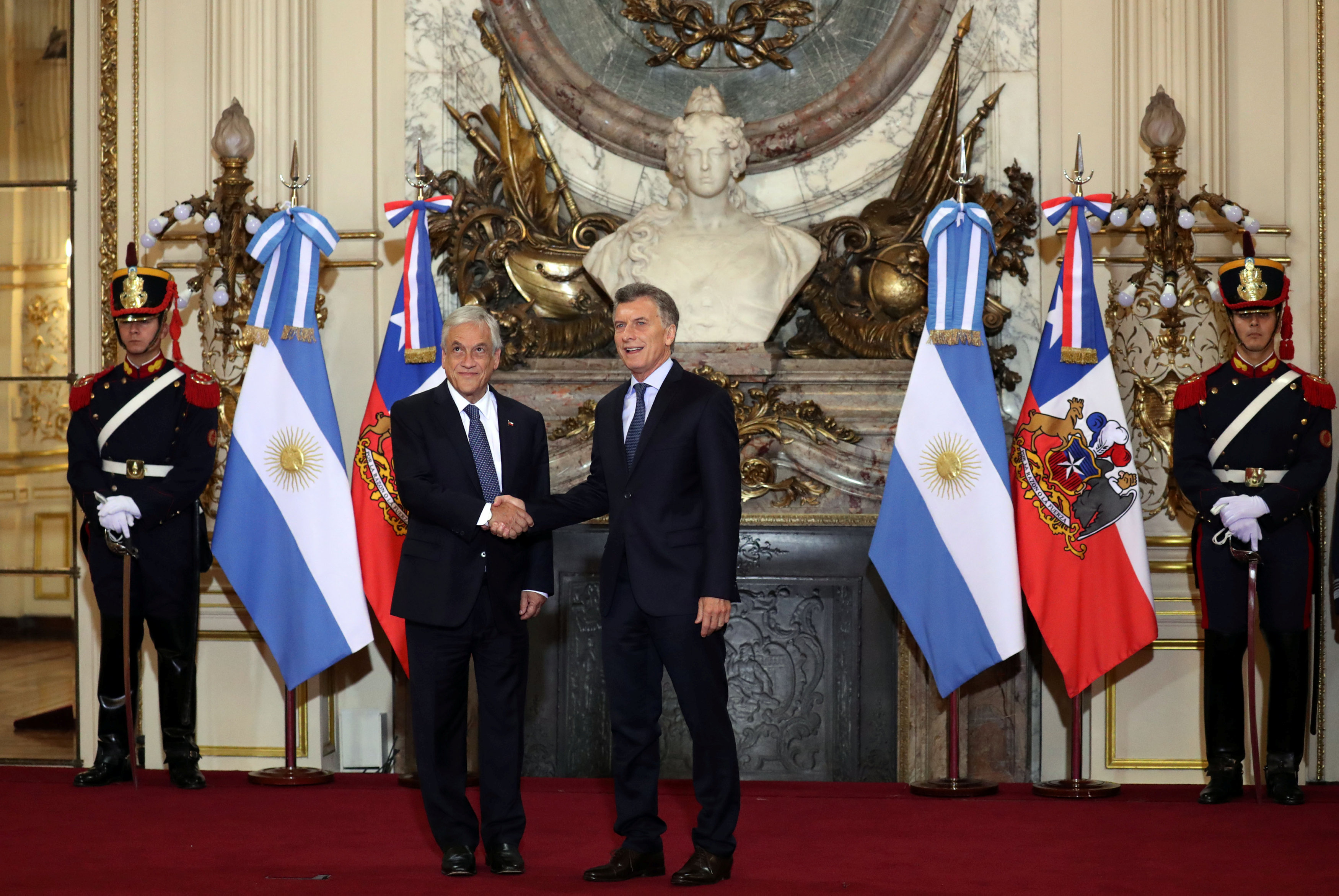 Argentine President Macri and his Chilean counterpart Pinera shake hands at the Casa Rosada Presidential Palace in Buenos Aires