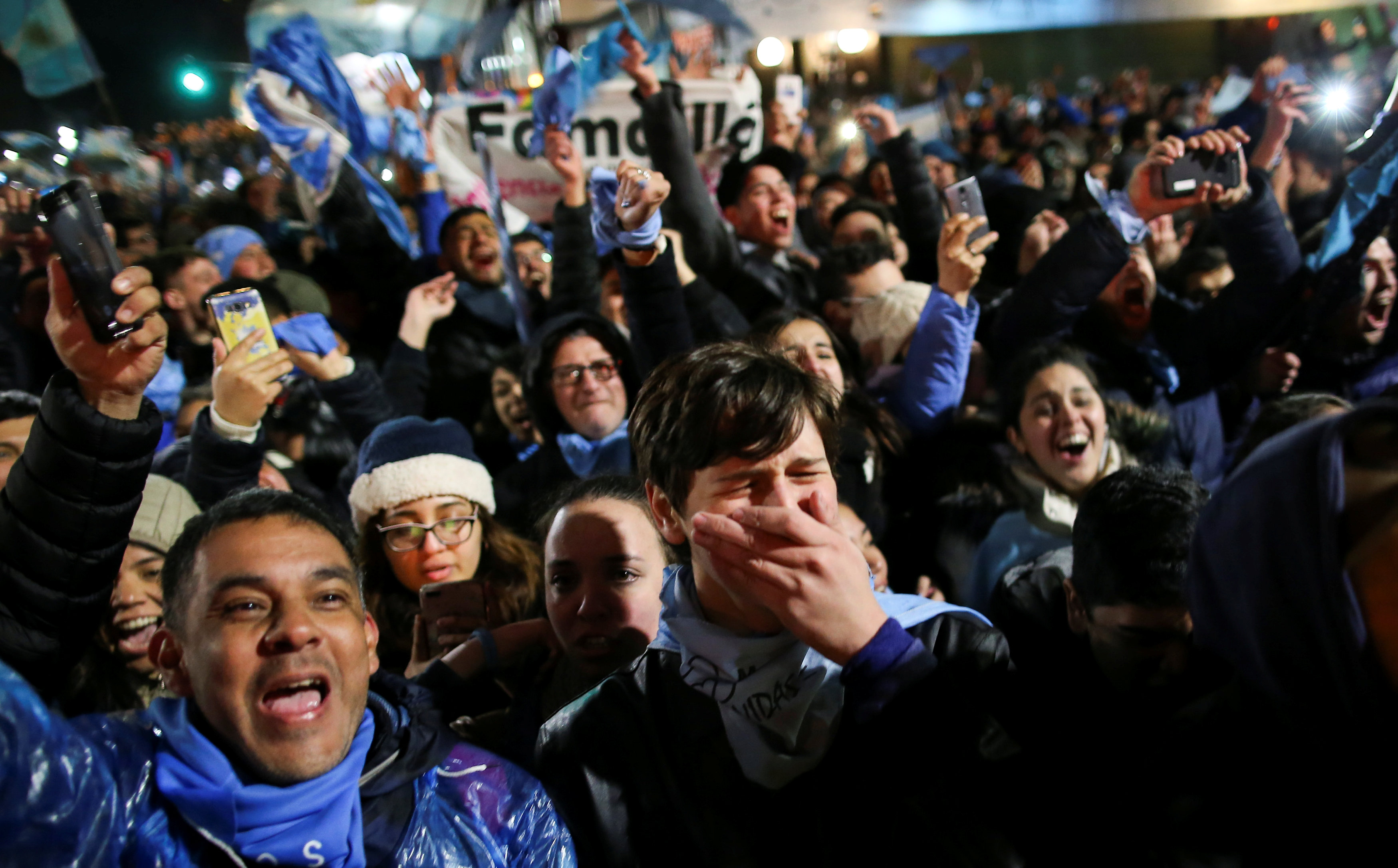 Anti-abortion rights activists celebrate lawmakers voted against a bill legalizing abortion, in Buenos Aires
