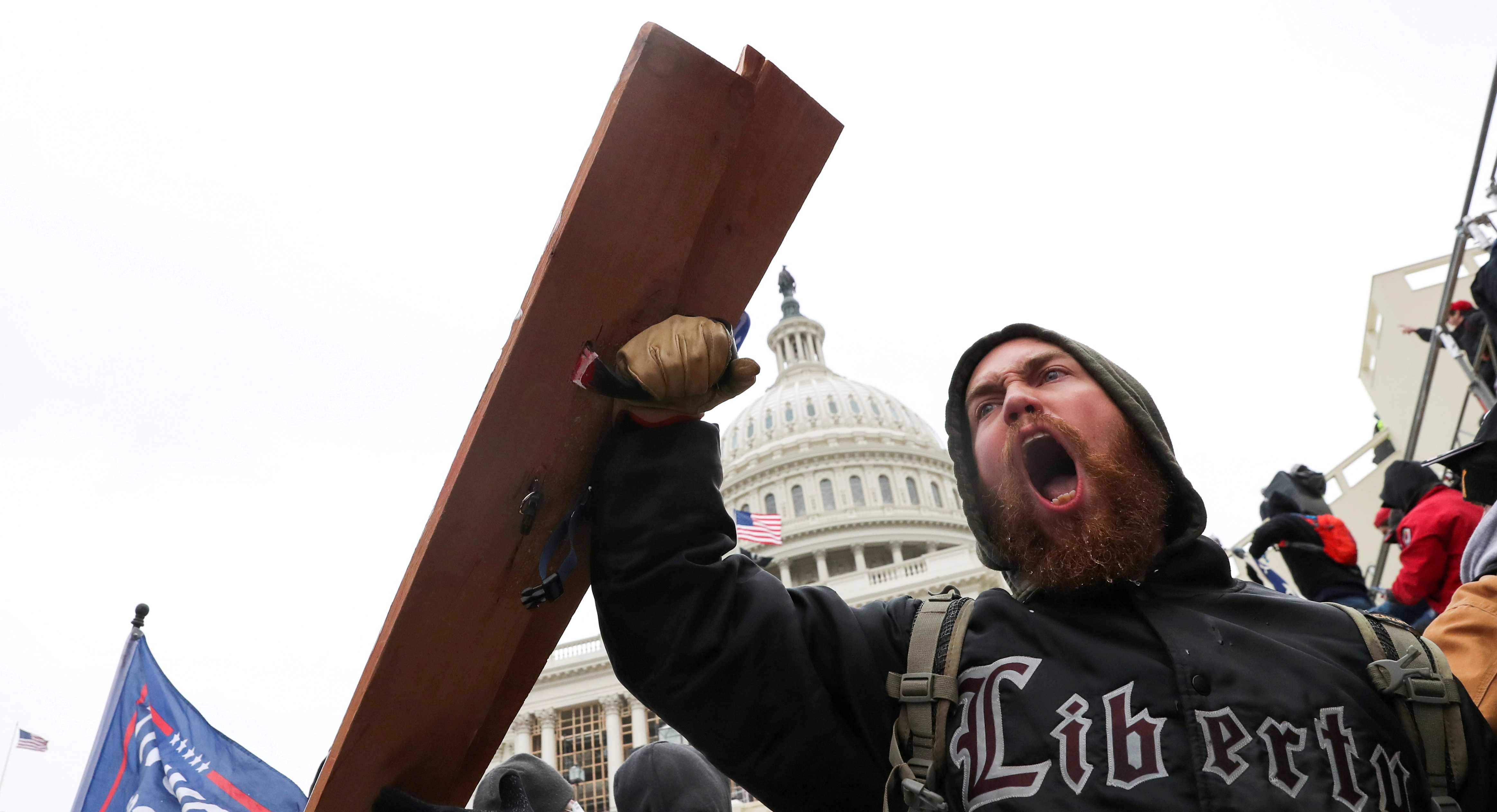 A man shouts as supporters of U.S. President Donald Trump gather in front of the U.S. Capitol Building in Washington, U.S., January 6, 2021. REUTERS/Leah Millis     TPX IMAGES OF THE DAY